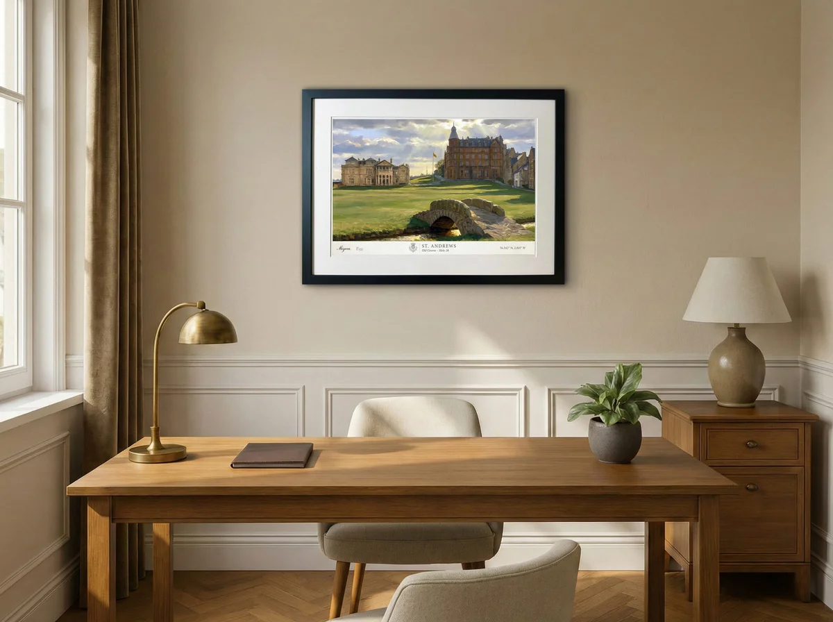 A framed St Andrews fine-art edition displayed above a desk in a home office